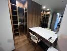 Modern home office with wooden cabinetry and desk