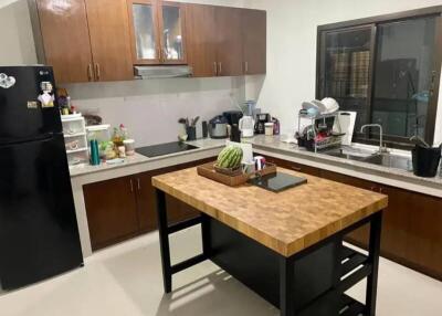 Modern kitchen with wooden cabinets and island