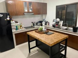 Modern kitchen with wooden cabinets and island