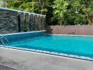 Outdoor swimming pool with surrounding greenery