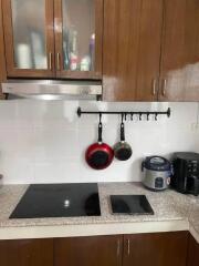 Modern kitchen with brown cabinets and appliances