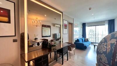 Spacious living room with modern furniture and large window