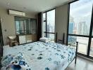 Modern bedroom with large windows and city view