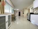 Modern kitchen area with appliances and dining space