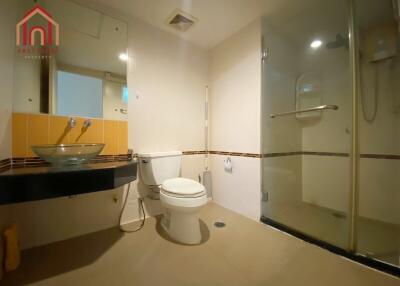 Modern bathroom with glass shower and vessel sink