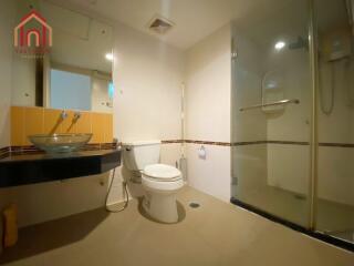 Modern bathroom with glass shower and vessel sink