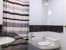 Modern bathroom with striped shower curtain and mosaic-tiled accents