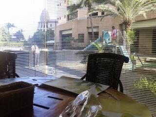 Patio area with a view of a playground