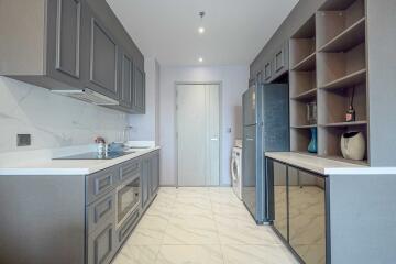 Modern kitchen with grey cabinets and appliances