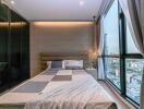 Modern bedroom with large window and city view