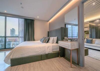 Modern bedroom with large windows and city view