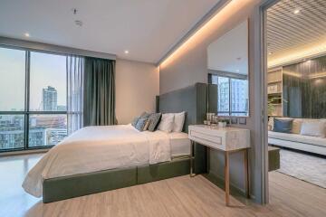 Modern bedroom with large windows and city view