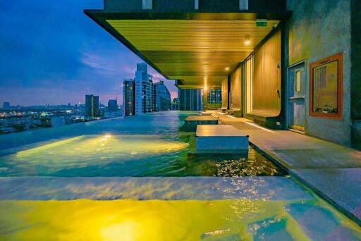 Luxurious rooftop infinity pool with city skyline view