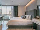 Modern bedroom with large bed and city view from window