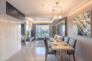 Modern living and dining area with city view