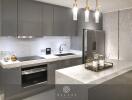 Modern kitchen with gray cabinetry, marble countertops, and hanging pendant lights