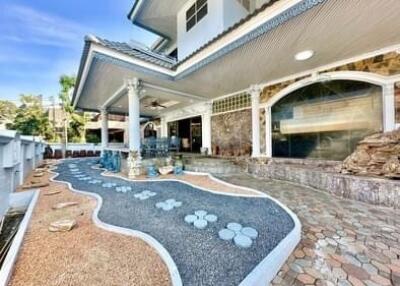 Exterior view of a house with unique landscaping