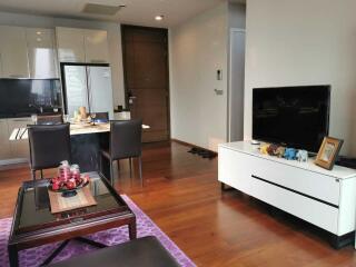 Modern living room with hardwood floors and contemporary furnishings