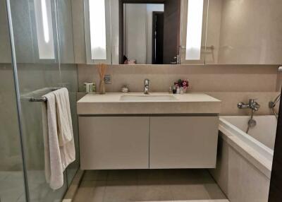 Modern bathroom with vanity, sink, mirror, shower, and bathtub
