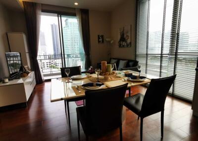 Modern living and dining area with city view