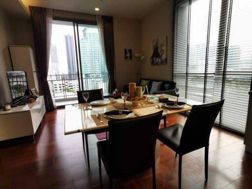 Modern living and dining area with city view