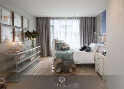 Modern bedroom with decorative elements and natural light.