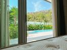 View from bedroom with sliding glass doors leading to outdoor area