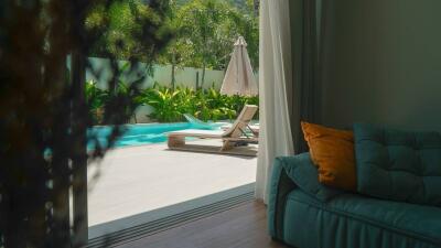 Living area overlooking a beautiful pool