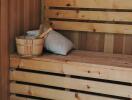 wooden sauna with bench and accessories