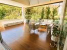 Patio with outdoor furniture and lush greenery