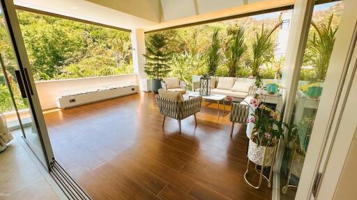 Patio with outdoor furniture and lush greenery