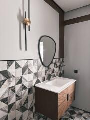 Modern bathroom with geometric tile design