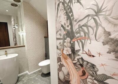 Luxurious bathroom with artistic wall design