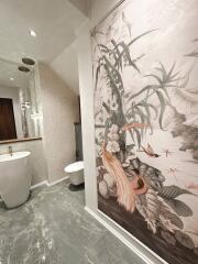 Luxurious bathroom with artistic wall design