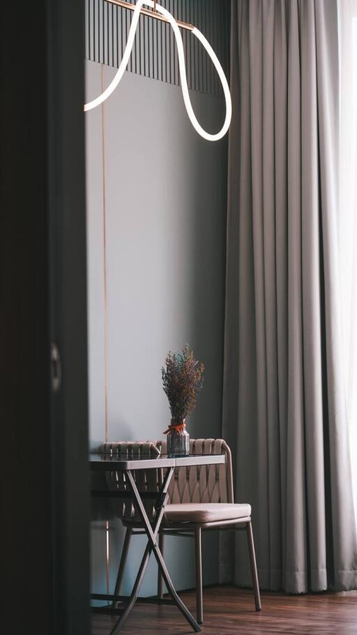 Cozy bedroom corner with a table and chair