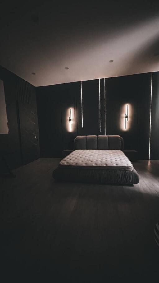 Modern minimalist bedroom with ambient lighting