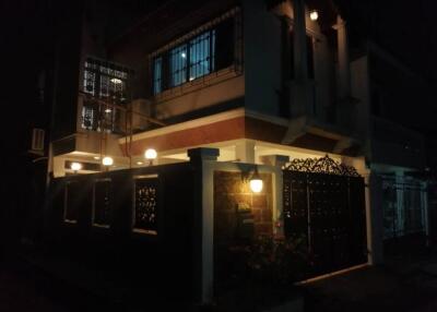 Night view of a residential building with exterior lighting