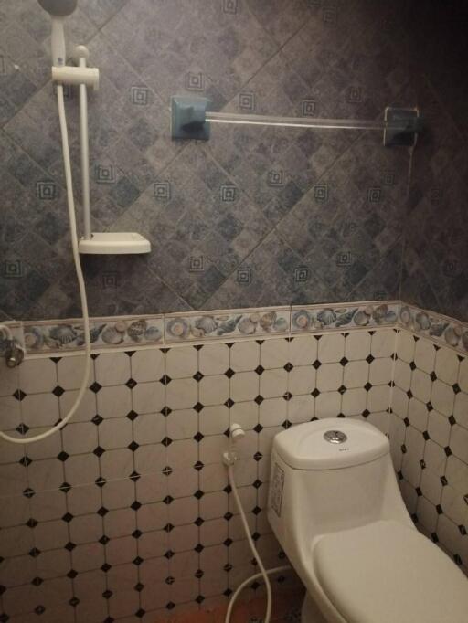 Bathroom with tiled walls and shower