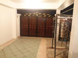 Spacious garage with decorative gated entrance