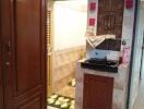 A well-maintained bathroom with wooden cabinets and decorative tiles