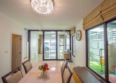 Bright dining room with a chandelier