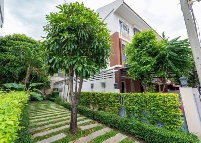 Front view of the residential building with garden