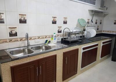 Modern kitchen with double sink and ample storage