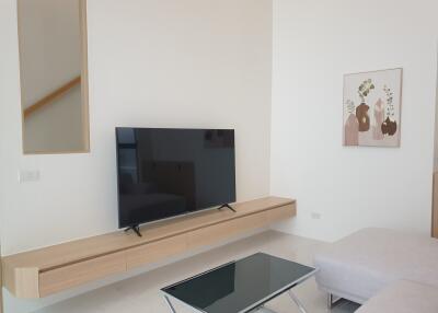 Modern living room with wall-mounted TV