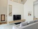 Modern living room with minimalistic decor and a flat screen TV