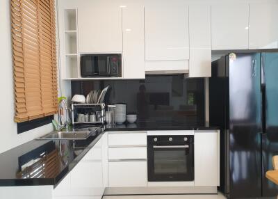 Modern kitchen with black and white cabinetry