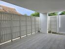 Covered balcony with privacy fencing