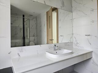 Modern bathroom with marble design and large mirror