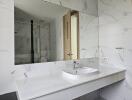 Modern bathroom with marble design and large mirror