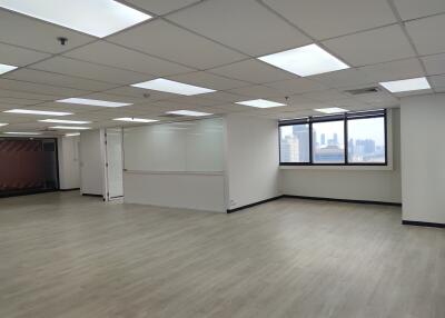 Spacious empty office with large windows